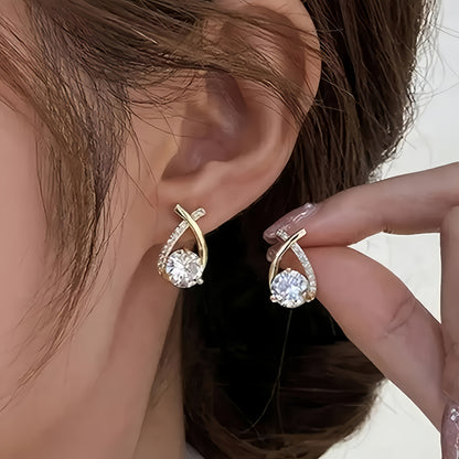 Orecchini a bottone con croce dorata e zirconia scintillante