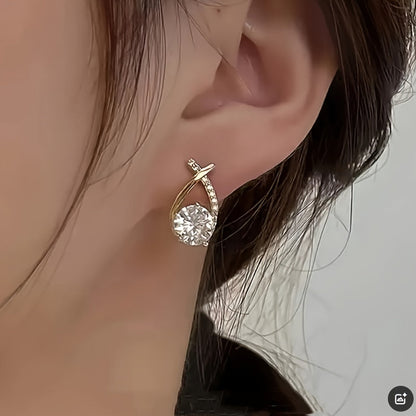Orecchini a bottone con croce dorata e zirconia scintillante