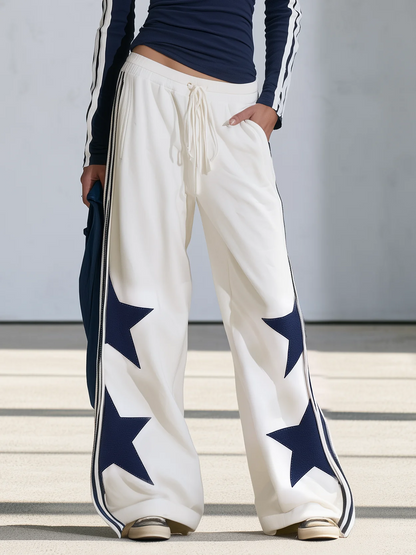 Celia | Completo di top a manica lunga con stampa di stelle blu navy e pantaloni a gamba larga